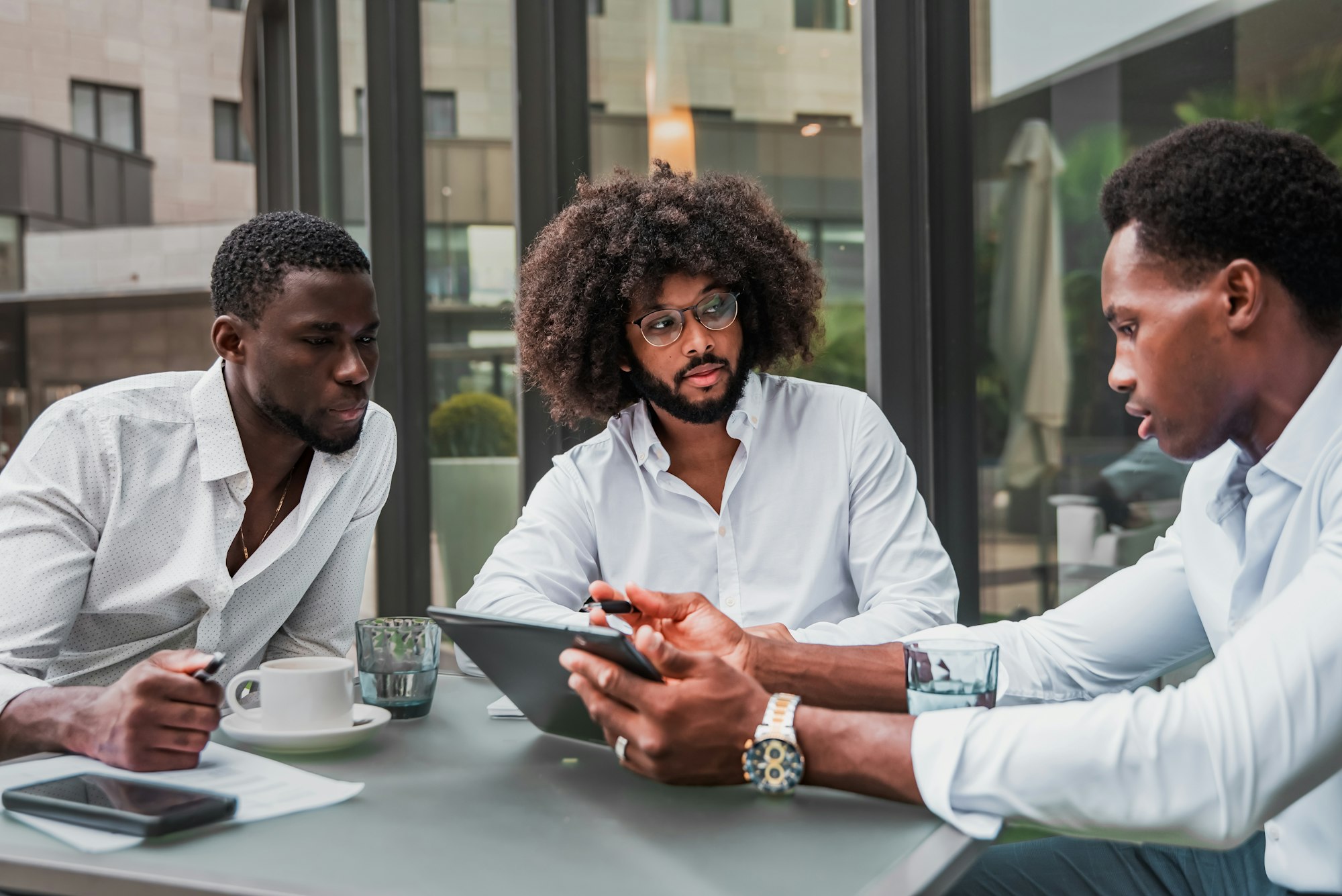 Multiracial business people working outdoor using digital tablet